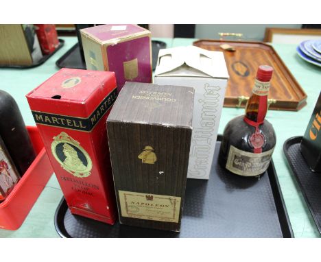 A bottle of Martell Medaillon VSOP cognac, two bottles of Grand Marnier and two bottles of Napoleon cognac