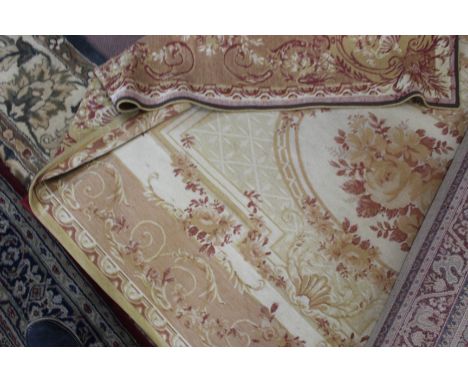 Three machine made Persian pattern rugs (one circular) plus a Laura Ashley style Aubusson tapestry