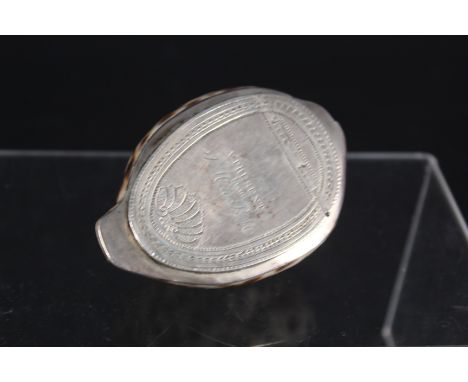 An 18th Century cowrie shell snuff box bright cut engraved white metal lid with engraved inscription 'A Present from J.M to P
