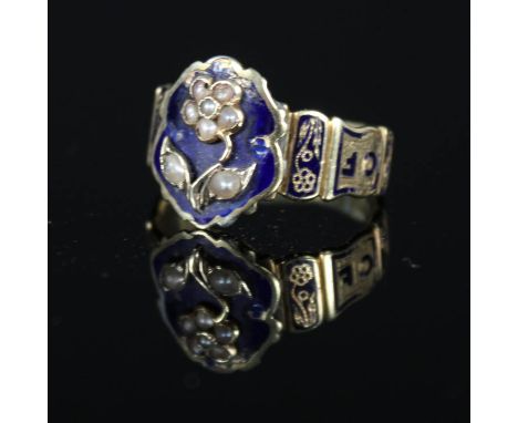 An antique gold memorial ring, the shank engraved 'In Memory Of' with blue enamel decoration, the centre a blue enamel shield