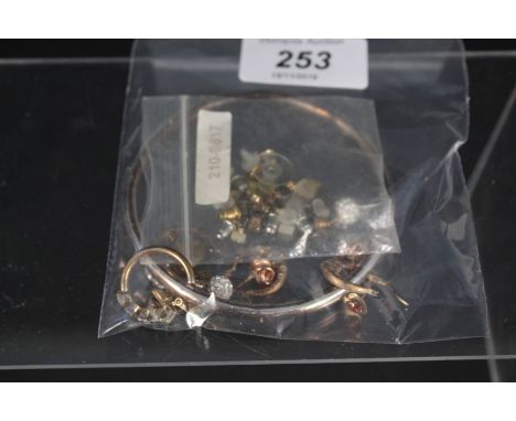 Two pairs of 9ct gold hoop earrings, a silver bangle plus a small quantity of yellow metal earrings