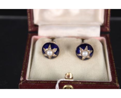 A pair of yellow metal earrings decorated with blue enamel background cut star middle with pearl centre and old cut diamond b