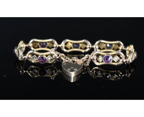 A 9ct gold bracelet set with amethyst and seed pearls (one pearl missing) with 9ct gold heart shaped padlock clasp
