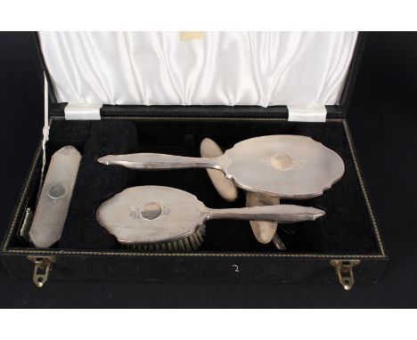 A four piece silver backed dressing table set (comb as found) plus a silver backed nail buffer