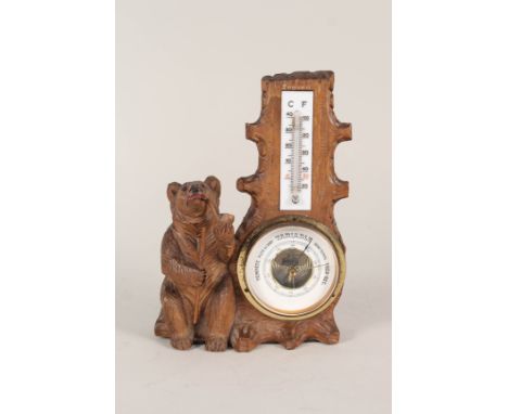 A Black Forest bear barometer/thermometer, height 8"