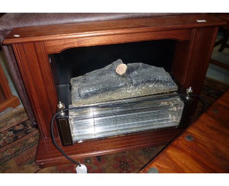 Electric fire in mahogany surround