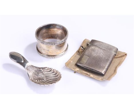 Silver caddy spoon, Sheffield 1921, maker Thomas Bradbury & Sons Ltd together with a silver napkin ring, Birmingham 1959, and