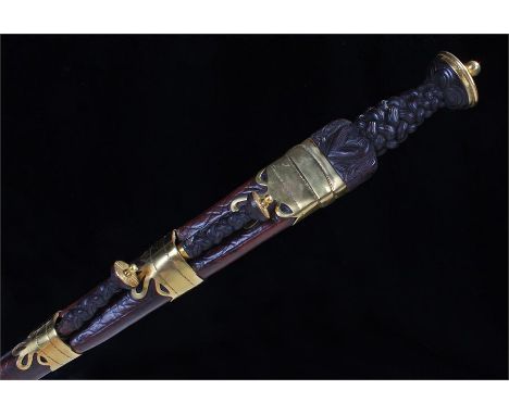 Scottish Dirk with Celtic knot grip contained in a brass mounted leather scabbard with knife and fork in the usual position R