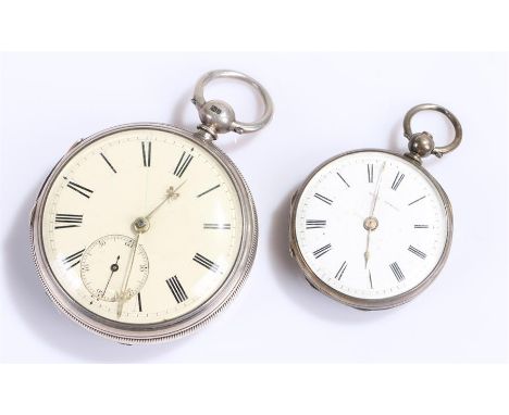 Two silver open face pocket watches, the first with a white enamel dial and Roman hours, the second smaller example with a di