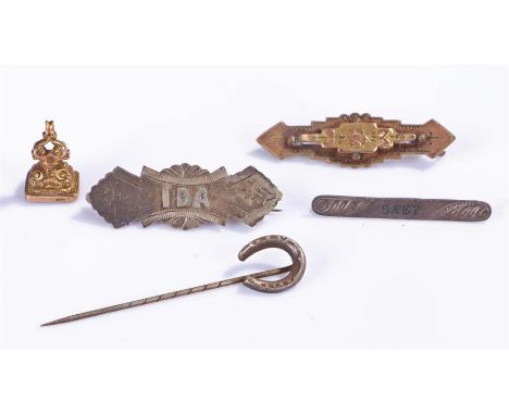 9 carat gold seal, with red stone, together with three brooches and a stick pin with a horse shoe, (5)