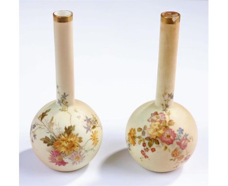 Pair Royal Worcester bottle vases, typically decorated with floral sprays on a blush ivory ground, model No. 1215, 16.5cm hig