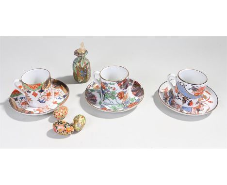 Spode coffee cups and saucers, limited editions, Ikebana, Kyoto Fan and Arita, together with a glass vessel and eggs