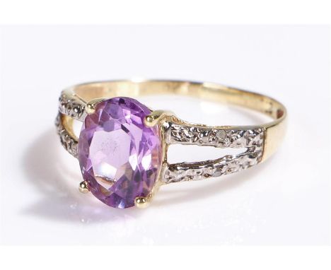 9 carat gold amethyst and diamond ring, set with a oval cut amethyst, ring size N