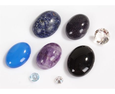 Unmounted stones, to include an amethyst, cubic zirconia, black onyx, sodalite, blue agate, blue topaz, a clear stone and blu