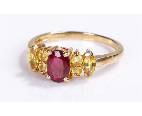 9 carat gold simulated ruby ring, with a central simulated ruby flanked by stones 