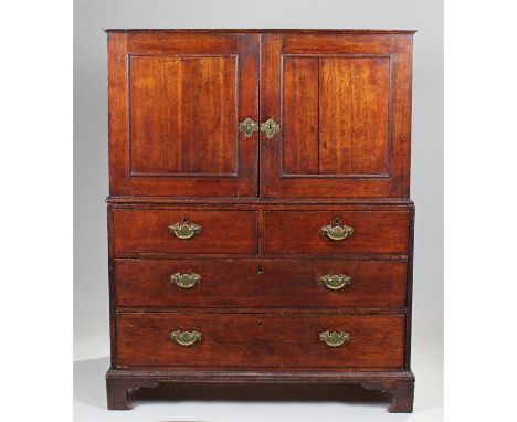 18th Century oak press chest, the rectangular top above a pair of cupboard doors, the base section with two short and two lon