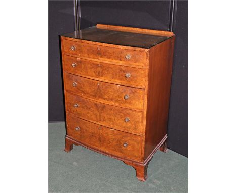 Early 20th Century walnut bow fronted chest of drawers, the gallery back with a bow fronted top above five graduated drawers 