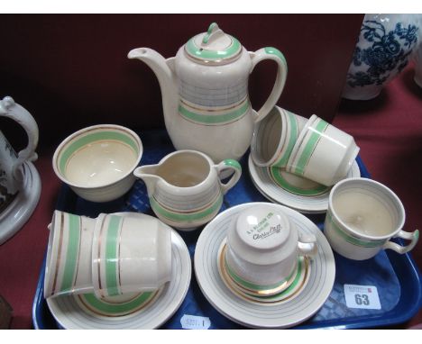 A Clarice Cliff (A J Wilkinson Ltd) Coffee Service, decorated with green, grey and gilt bands on a cream ground, comprising c