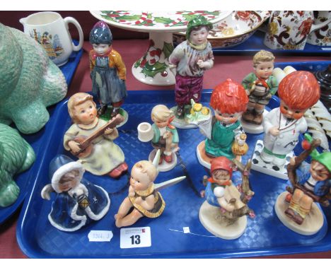 Nine Hummel Figures, including Blue Angel with Lantern, Angel with Instrument. Plus a pair of Continental porcelain figures o