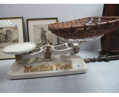 A Set of Mid XX Century Mellin's Food Cast Iron Baby Scales, with a wicker cradle.