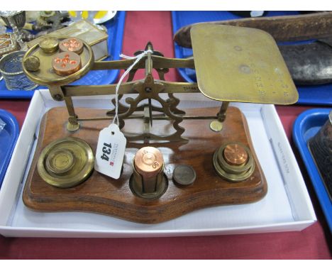 Brass Postal Scales, on serpentine mahogany base; together with weights.