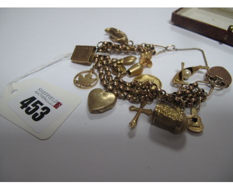 A Three Row Belcher Link Bracelet, stamped "9ct" to padlock style fastener and safety chain, suspending numerous charms, incl