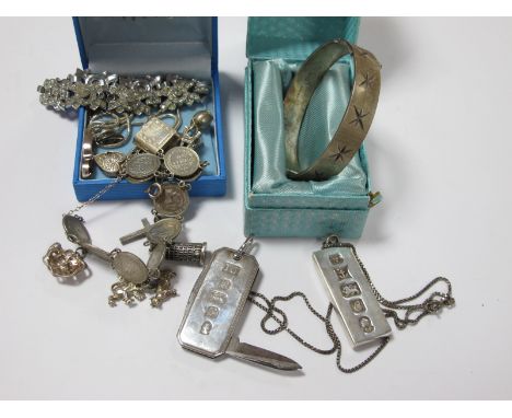 A Hallmarked Silver Wide Bangle, with allover textured star design, with safety chain, in a box, a hallmarked silver ingot pe