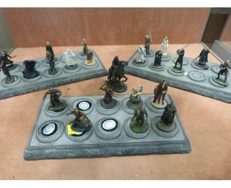 Collection of 'The Lord of the Rings' cold metal painted figures by NLP 2004 along with three stands