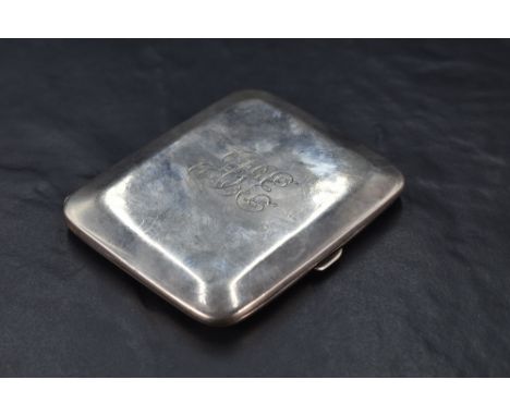 A George V silver cigarette case, of hinged rectangular form with rounded corners and chamfered edge detail enclosing engrave