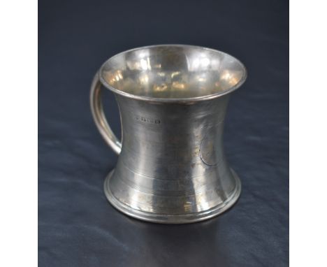A George V silver mug, of flared cylindrical form with bands of engine-turned decoration and vacant circular cartouche, marks