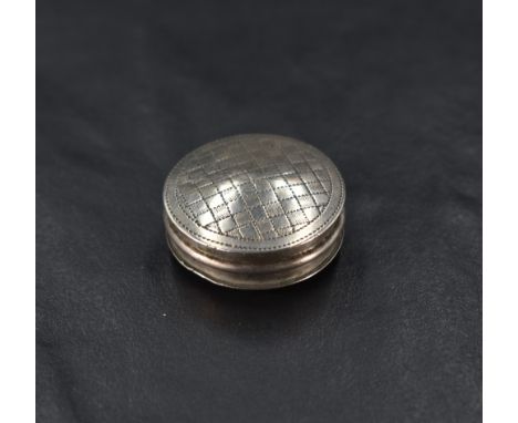 A George III silver pill box, of slightly domed circular form with pull-off cover engine-turned with chequer-board pattern, m