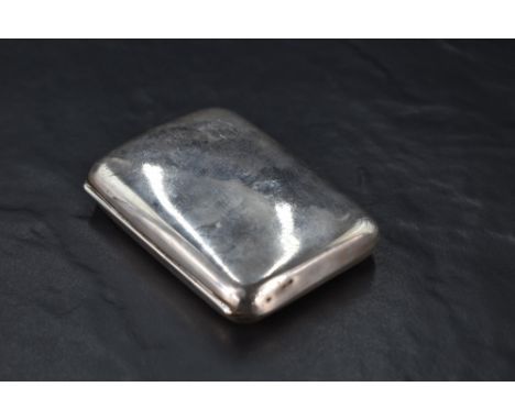 A George V silver cigarette case, of hinged rectangular form curved for the gentleman's pocket and engraved with initials 'DE