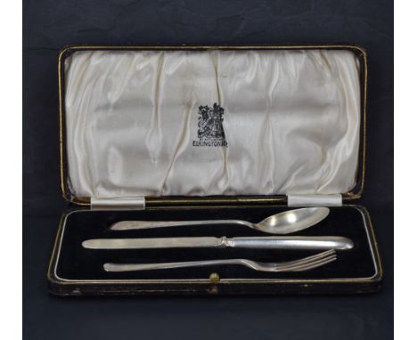 A George V cased silver christening set, comprising an Old English pattern knife, fork and spoon with engraved initials GE, m