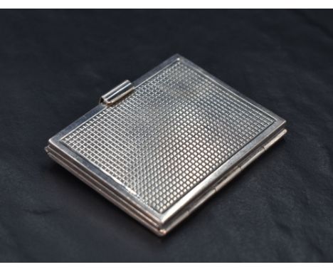 A Queen Elizabeth II silver three-fold travelling photograph frame, of hinged rectangular form with engine-turned textured su