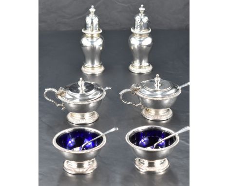 A Queen Elizabeth II six-piece silver condiment set, comprising a pair of baluster pepperettes, pair of circular salts, and a