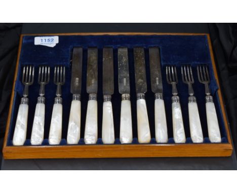 A group of George V Mother-of-pearl handled silver dessert cutlery, comprising six forks and six knives, each with marks for 