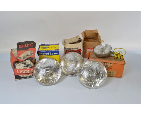 Five boxed car lamps, comprising a Lumax automobile lamp, fog model F8, a Sealed beam 12v by Hella, Orsam and two others