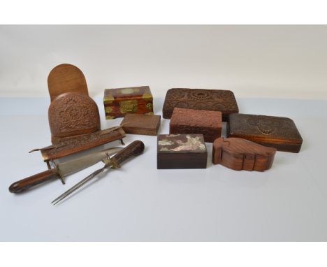 A small collection of carved Indian and Chinese boxes, including a card box, book slide, hardwood jewellery box with brass mo