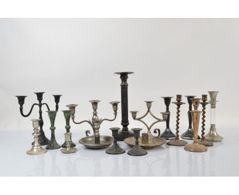 A collection of silver plated and metalware candelabra and candlesticks, including a 1930s three branch centre piece, a bronz