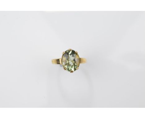 A certificated 9ct gold green amethyst dress ring, oval cut with cabochon table and cut pavilion in six claw setting, ring si