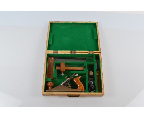 A cased woodworking tool set, by Faithful Tools, including planes, right angles etc in a varnished fitted case, 39cm x 30cm x