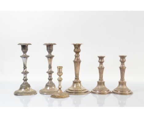 A pair of Reed and Barton silver plated candlesticks, 26cm high, together with a pair of silver plated hand chased Sheffield 