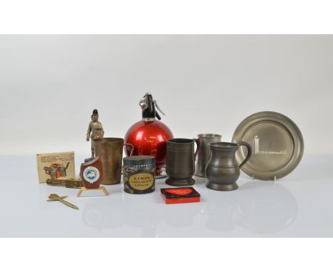A vintage burgundy Sparklets soda syphon, together with two novelty cigarette lighters, one in the form of a knight in armour