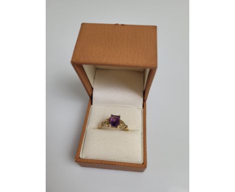 A 9ct gold amethyst dress ring, the mixed cut rectangular claw set amethyst with pierced set shoulders, plain gold shank, QVC