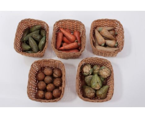 Collection of antique miniature painted ceramic vegetables, carrots, cauliflowers etc, presented in woven baskets