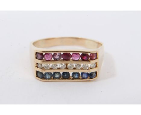 Diamond, ruby and sapphire triple row ring with round cut stones in 14K yellow gold channel setting. Finger size P.Condition 