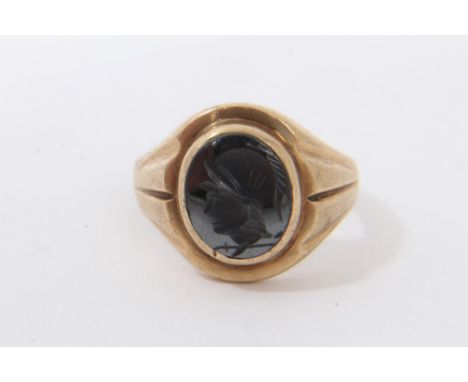 Gold 9ct seal ring with engraved hematite plaque depicting a Roman soldier's head, ring size Q½Condition report: Weight appro