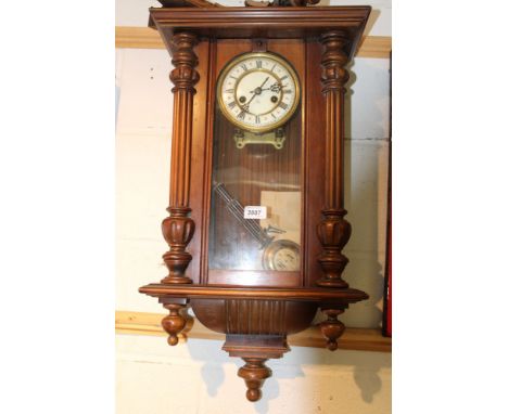 Vienna regulator-style wall clock in walnut case