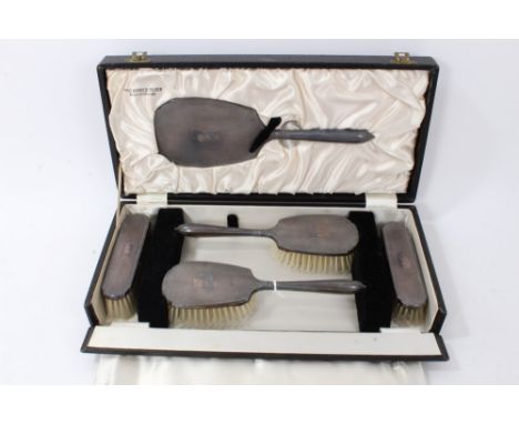 Five piece contemporary silver dressing table set comprising two pairs of brushes and a hand mirror with engraved initials, i