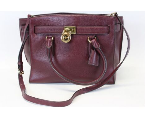 Michael Kors mulberry leather handbag with logo padlock to front. Engraved zipper pull and MK logo lining. Plus Michael Kors 